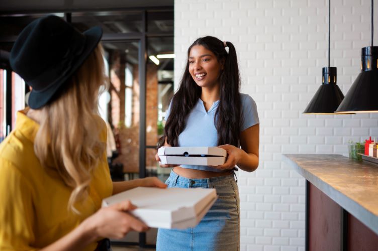 Medium shot happy friends with pizza